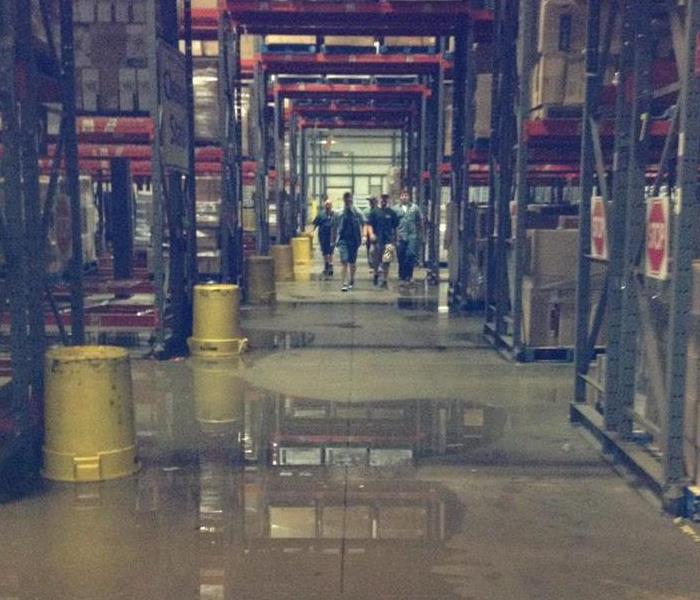 Servpro Team Members Addressing A Large Commercial Loss in a warehouse